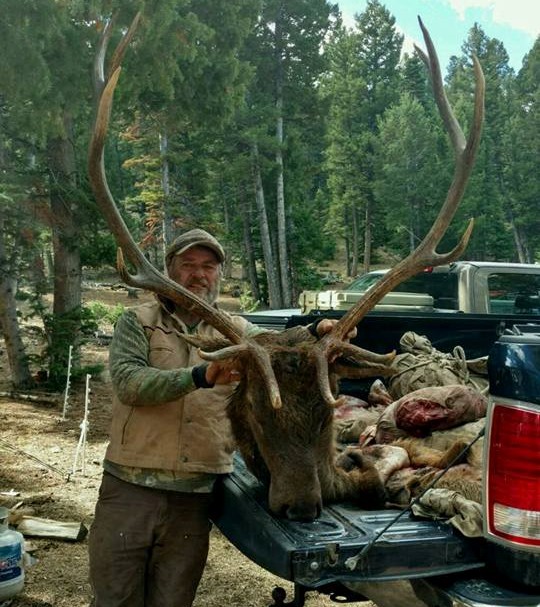 Hunter with Elk Head